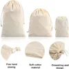 Sacs de rangement 20 pcs/lot tissu en coton Beige naturel petit avec cordon cadeau Bolsas Para Empacar Productos jouet