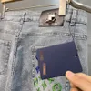 Pantalones de ajuste de moda de primavera para hombres diseñador para hombres jeans de tendencia azul bordada de ajuste delgado