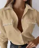 Blusas de mujer Blusa de mujer de moda 2024 Primavera con cuentas abotonadas Diseño de bolsillo Casual Llanura Cuello vuelto Manga larga Camisa diaria Top