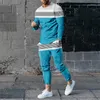 Spring Autumn Mens randig träning 2 -stycken Set Fashion Sportwear Streetwear Långärmad T -skjorta Byxor Män kläder 240119