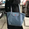 Mode polyvalent femmes sac boulette sacs classique marque femmes nouveau pliable étanche en Nylon fourre-tout sacs dames sacs à main 10A