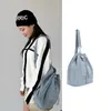 Mochilas escolares 2024, bolso de hombro a la moda para mujer, bolso de verano Vintage de tendencia coreana para mujer, mochila vaquera azul con cordón para mujer