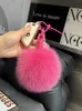 Macio bonito real natural pele de raposa pompom chaveiros bola de pelúcia brinquedo feminino saco charme ornamentos carro chaveiro pingente meninas highend presente 240122