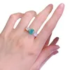 حلقات الكتلة الأوروبية والأمريكية S925 Silver White Fritillaria inlaid 7 9 Paraiba High Carbon Diamond Flower Ring