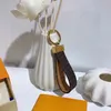 M65221 Dragonne Çanta Tutucu Tasarımcı Çiçek Tuval Keychain Araba Ticari Zincir Yüzük Takımı Pochette Accessoires Kimlik Name Etiketi Damgalama 274K