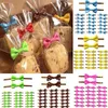 Moules de cuisson 100pcs Bowknot Tie Twis Ties pour gâteaux Candy Cookie Sacs Scellage Bakeware