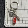 Keychains brandmotorsläckare Ax Cap Dept brandman Brandman Keychain Keyring Man -tillbehör smycken hänge