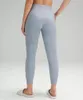 LL Mujeres Jogging Yoga Noveno Pantalones Bolsillo Fitness Leggings Suave Cintura Alta Levantamiento De Cadera Elástico Pantalones Casuales Piernas Con Cordón Pantalones De Chándal Dance Studio Joggers