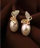 اكتشاف Pearl E301 Pearl Earrings Butterfly أقراط 08819446