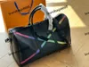 2023 Duffel Bags Luxury Fashion Men Women Travel Duffle Bags Brand Designer Bagage Handväskor med lås Stor kapacitet Sportväska storlek 50 cm
