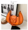 2024 Handväska Ladies Luxury Bags Designer Mini Bag Leisure Travel Ribbon Tote Bag Läder Material Fashion Shoulder Bag Wallet Axillary Pouch A2