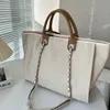 ショルダーバッグ高級デザイナー女性クラシックキャンバスハンドバッグ有名なフランスブランドファッションパールレターショッピングバッグ大容量高品質のチェーンデザイナーバッグ