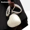 Borsa a cuore in acrilico da donna firmata da sera per feste, carina pochette color perla con tracolla all'ingrosso 240130