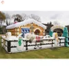 vente en gros activités de plein air de bateau gratuit publicité gonflables Noël 7.3x5.1 m maison de Noël gonflable géante de la grotte du Père Noël avec une belle impression