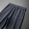 Pantalon de garde de loisirs pour hommes, coupe cintrée, polyvalent, tendance, brodé, pieds à nouer, pantalon de sport, printemps et automne