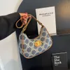 Début de l'automne nouveau tissu arc de triomphe sous les bras méthode bâton unique épaule sac à main carré polyvalent à la mode sac pour femme ventes directes d'usine