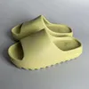 Designer tofflor man tofflor skissar kvinnor sandal pantoufle vit harts rent ockra ben skum löpare herr kvinnor glid eva slidersrunner clog sot skor