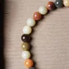 Braccialetti con ciondoli Carbonio al forno Caramella Palla colorata Radice di Bodhi Gradiente colorato Duobao Anello da corsa esposto alle intemperie Nappa Gancio per auto portatile