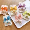 Accessori per capelli 2 pezzi/set fermagli per fiocco floreale per ragazze bambino tornante clip a becco d'anatra bambini semplice copricapo con frangia per bambini