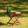 Table pliante en bois robuste avec pieds en métal, idéale pour les barbecues