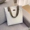 Midjepåsar bearbetning anpassning vävd handväska klass fast färgbok innehav canvas väska utskrivbara nisch kvinnors avslappnade