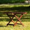 Table pliante en bois robuste avec pieds en métal, idéale pour les barbecues