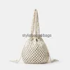 Totes Bohemian Hollow Bucket Bag Designer Rope Woven Women Shoulder Bags Drawsting Handväskor stor kapacitet Tote Big Bali Purse 2023H24217