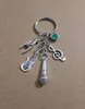 Whole Vintage Silver Green star stone Music symbolmicrophoneguitarrock gesture Charm Keychain Fit Key Chains Accessories Je2532752