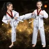 Vêtements ethniques 2024 Costumes TKD unisexes Blanc à manches longues Taekwondo Uniforme WTF Karaté Judo Dobok Suituit Enfants Adultes Gi Uniformes