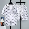 Été 2 pièces ensemble survêtement hommes faux deux chemises Shorts Harajuku Streetwear surdimensionné hommes ensembles tenues courtes costumes 240130