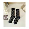 Meias de designer de meias femininas de comprimento médio agulha dupla dupla maneira meias de algodão outono e inverno instagram luxo edição coreana feminina tubo longo meia estilo coreano
