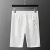 Marque d'été Survêtements pour hommes Shorts pour hommes T-shirt en coton noir et blanc à manches courtes imprimé costume décontracté pour hommes Men Jogger sport costume à manches courtes