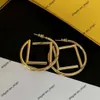 Boucles d'oreilles de marque de mode, bijoux circulaires réguliers, Texture métallique, lettres dorées, matériau en laiton, personnalisés, simples et polyvalents
