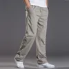 Mens casual Cargo Cotton pants men pocket loose Straight Pants Elastic Work Trousers Brand Fit Joggers Male Super Large Size 6XL y240122