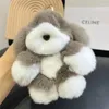 Nyckelringar Plush Dog Real Rex Fur Keychain Söt valp Kids Toys Women Bag Charm Pendant Car Key Metal Ring Ornaments Birthday Present