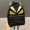 Unissex tecido à prova d'água preto bonito mochila sacos de penas designer menina dos homens mochila sacos de ombro marca famosa tamanho médio 22x2244l