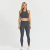 Herrdräkter med logotypsportbh -leggings set kvinnor stretch tyg som kör fitnesskläder gymträning leggingsr 2 st/set