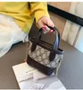 Designer Children Plaid Handbag Luxury Kids Letter Tryckt One Shoulder Bag Girls Pu Leather Messenger Bags Lady Style Women Mini 5257775