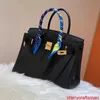 Bolsos de cuero genuino Bolso de lujo confiable Hilo de cera envuelto en platino con patrón de lichi Bolso de hebilla de cuero de becerro Togo Bolso de cuero genuino para mujer con logotipo HBQK