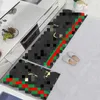 デザイナートレンディブランドキッチンフロアマットインターネットセレブリティライトラグジュアリーカーペット吸収油吸収非滑り床マットキッチンストリップセット