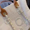 New Designer Bag Classic Tote Bag Large Capacity Handheld Bag Luxury High Quality Knitted Fashion Versatile Square Pearl Inlaid Design Luxury Bag 2024 05