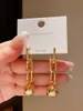 European and American metal horseshoe chain ball pendant long earrings women's retro temperament electroplated gold earrings
