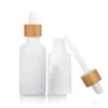 Bouteilles compte-gouttes en gros bouteilles d'huile essentielle en verre de porcelaine blanche flacon compte-gouttes de sérum de soin de la peau avec pipette en bambou 10 ml 15 ml 20 M Dhduj