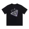 Designer Luxury Prads Classic 23 Ans Nouveau T-shirt Triangle d'été Imprimer Tendance à manches courtes à manches courtes pour hommes et femmes Pull à col rond Couple CP Même demi-manches