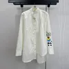 Women's Blouses & Shirts White cotton lapel neck long sleeved panda embroidered irregular cut shirt