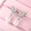 Baumeln Ohrringe Huitan Ästhetische Schmetterling Imitation Perle Für Frauen Luxus CZ Temperament Süße Braut Hochzeit 2024 Schmuck