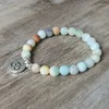 Bracelets de charme Mat Amazonite Pierre Strand Bracelet Yoga Chakra Mala OHM Lotus Femmes Hommes Perlé Bijoux Faits À La Main