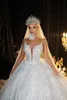 Robes de mariée de robe de bal de concepteur pure col haut manches longues robes de mariée paillettes à la main fleur balayage train princesse robes de mariage sur mesure