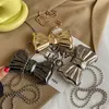 Metalowe mini Bow Crossbody Torby dla kobiet mody Srebrna złote torba na ramię Clutk Tortes Monety 240219