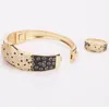 Hiphop europeo americano dominante con micro incrustaciones de circón negro esmalte leopardo hebilla brazalete animal de moda pulsera de leopardo para hombres accesorios personalizados